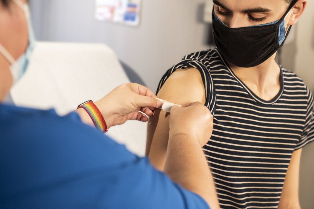 A person getting a plaster put on after an injection