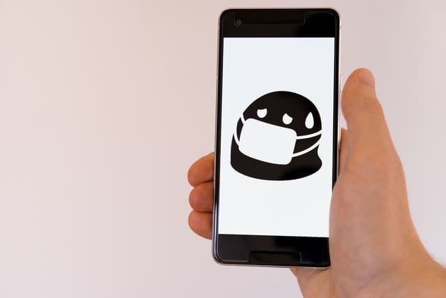 Phone Screen Showing Infectious Emoji