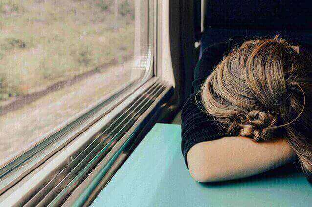 Exhausted Woman on Train