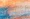 Abstract painting with a honeycomb pattern in blue, orange, and cream colours blending together, evoking an organic effect reminiscent of cells that tackle oxidative stress.