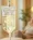 A close-up of a clear IV bag labelled Glutathione with a glowing solution, highlighting the process of Glutathione IV: Before and After, with a person sitting blurred in the background.